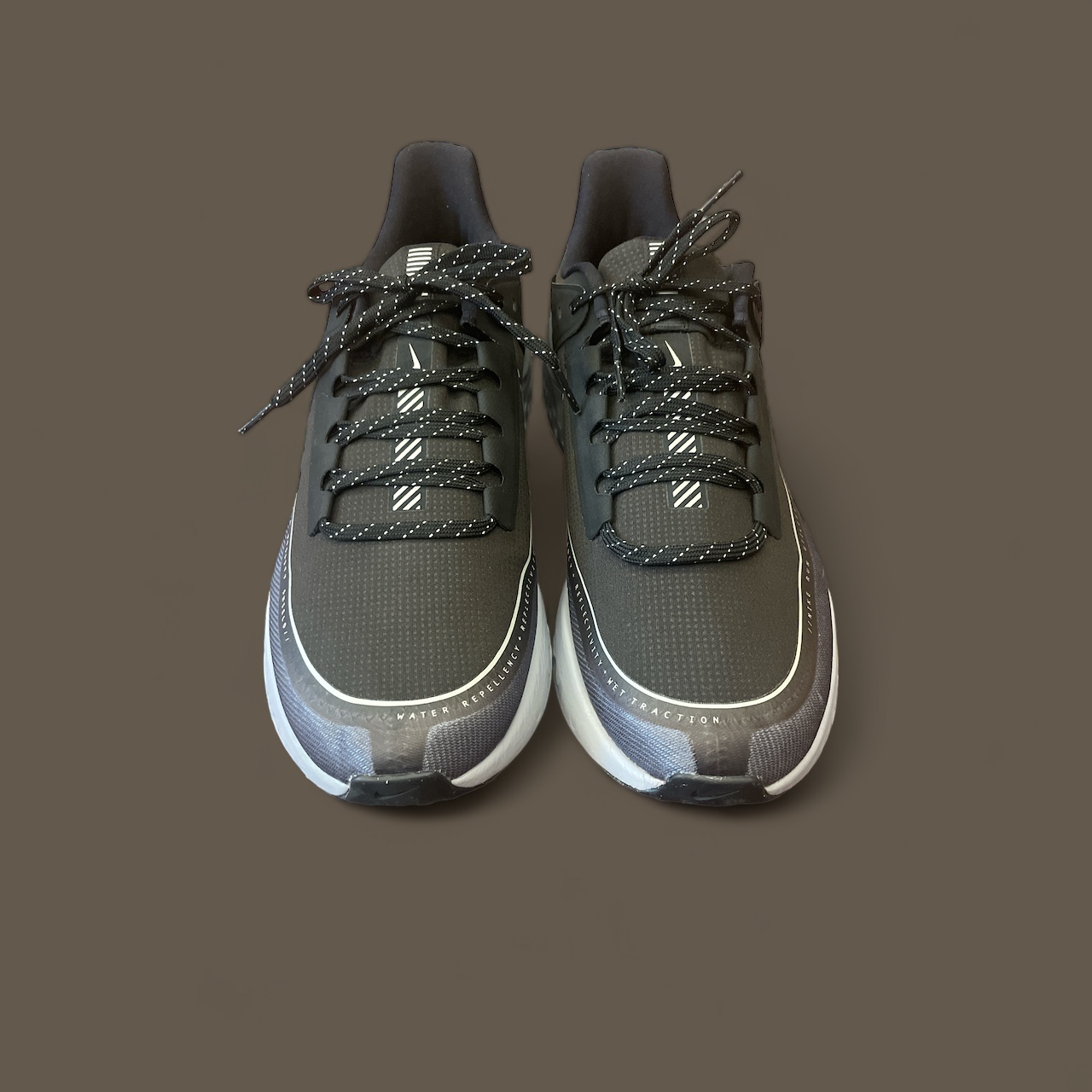 Nike_Mens_Black_React_Running_Shoes_Front_Brown_Background Nike_Mens_Black_React_Running_Shoes_Front_Brown_Background
